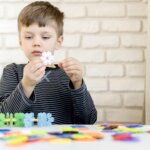 Young boy showing nonverbal signs – autism and speech delay in children